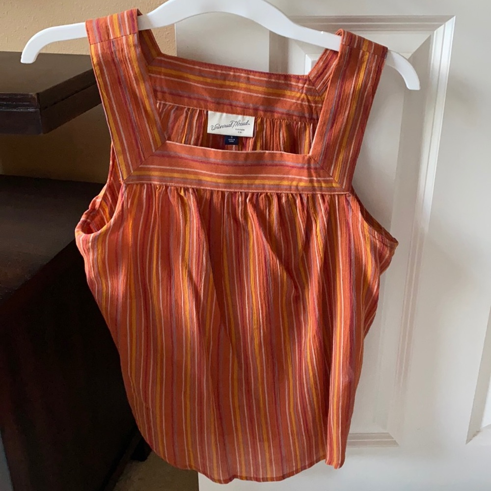 Cute orange tank top with stripes.